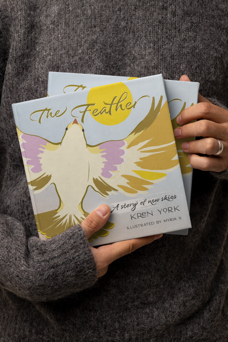 mockup-of-a-woman-showing-two-square-books-m26950