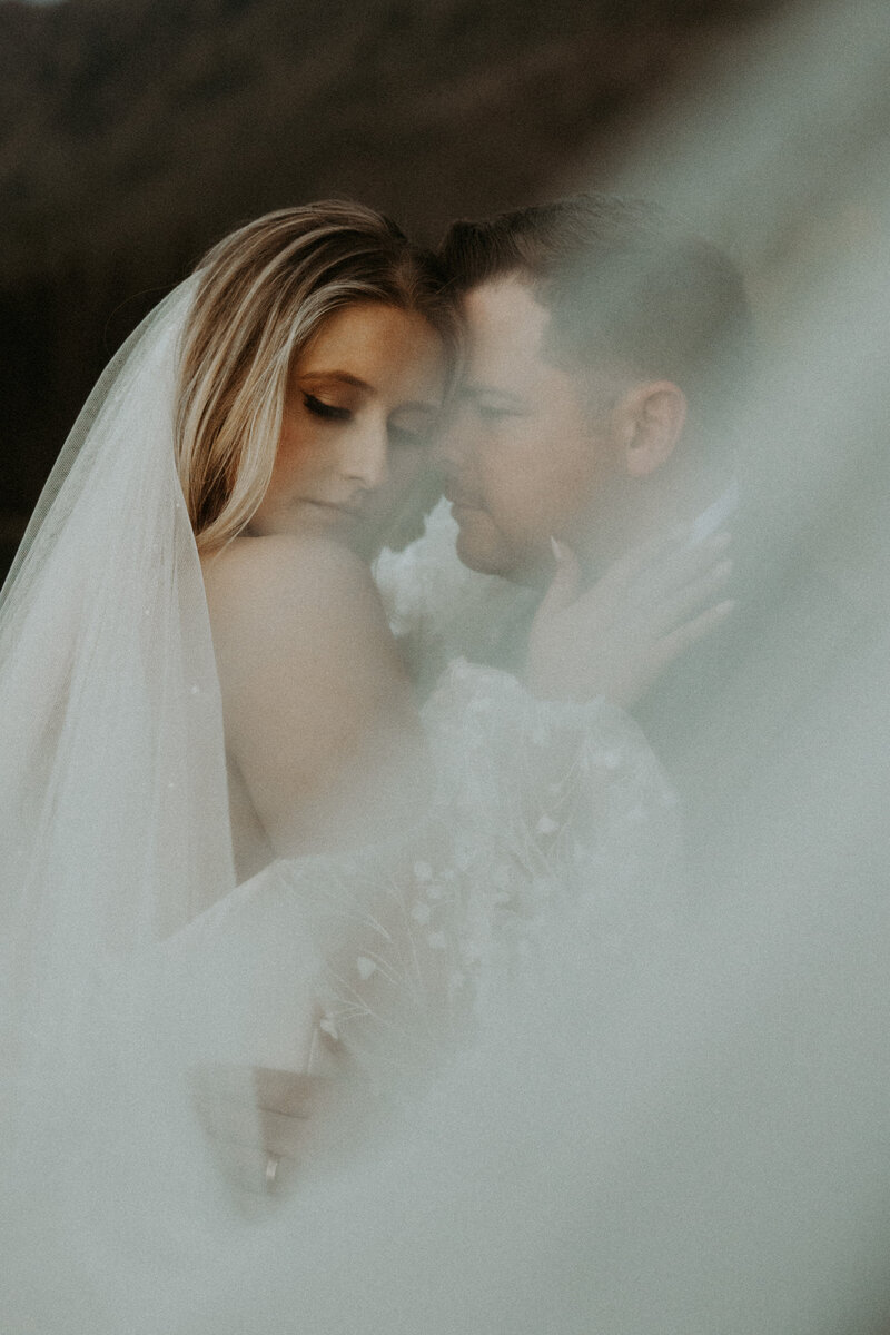 photo of bride and groom during their montana elopement with bride holding onto groom