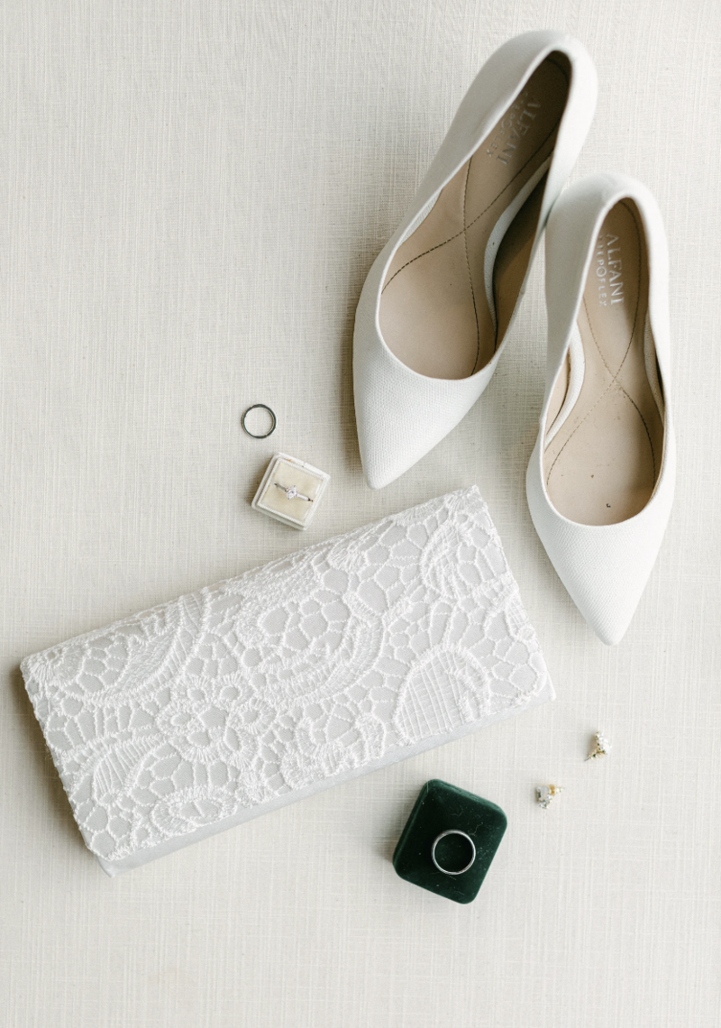 Natural linen flat lay mat with vintage stamps and florals for wedding styling