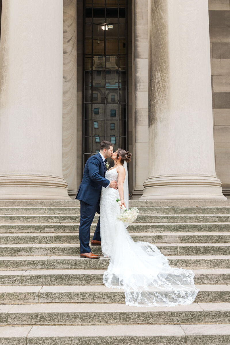 Photo of Bride and Groom kissing at Carnegie Hall in Pittsburgh PA