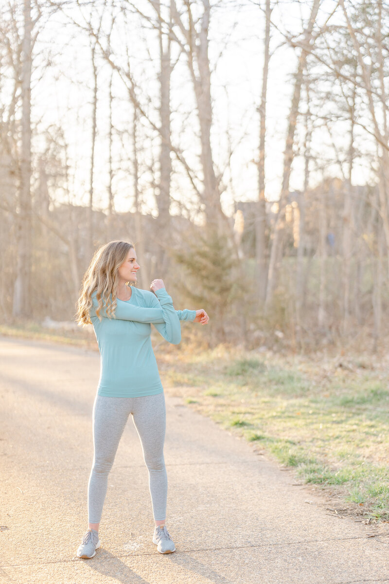 Woman stretching arm during Chantilly, VA branding photography