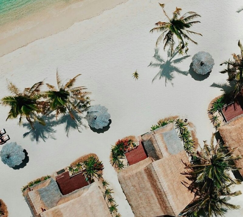 Arial photo of beach huts at cauayan island resort 