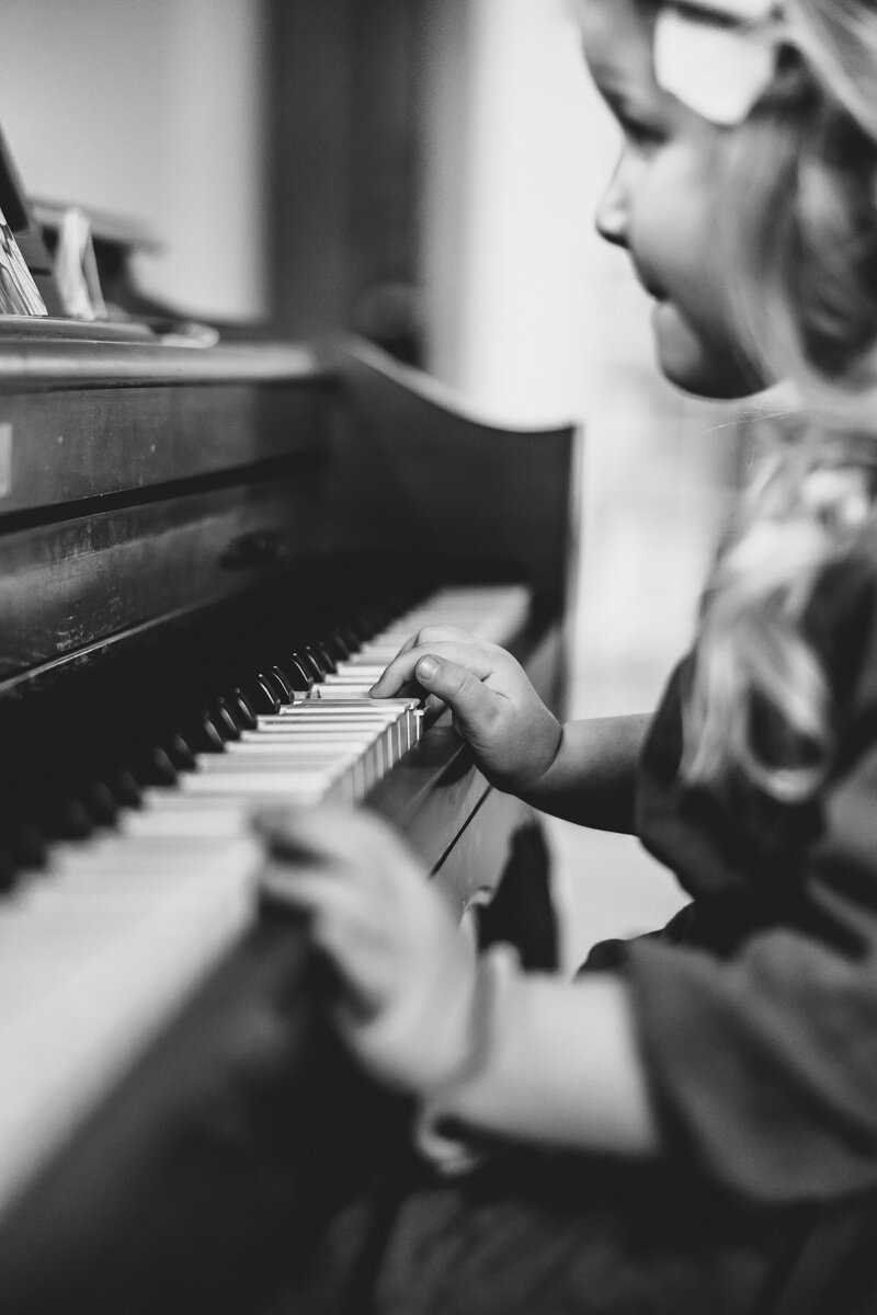 little girl playing piano