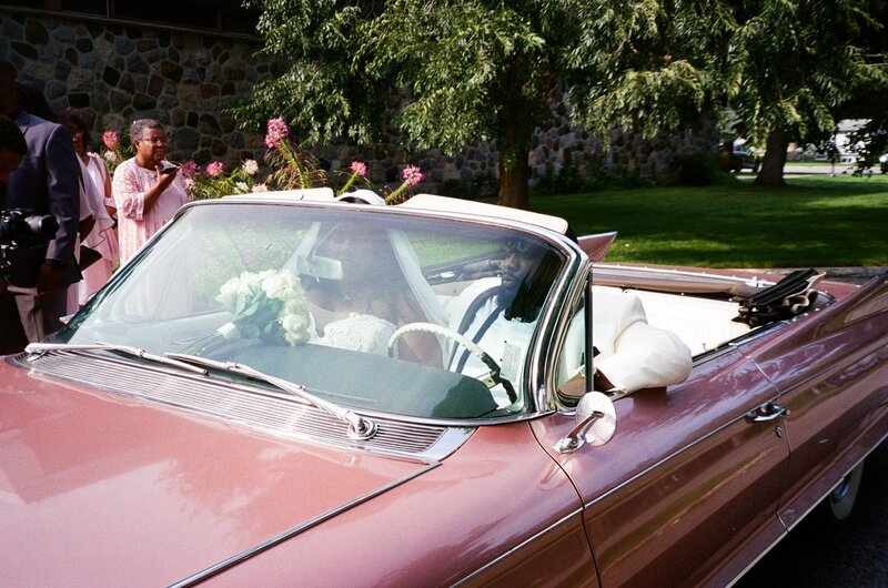 Candid moment of a bride wiping away tears during an intimate Ottawa elopement ceremony