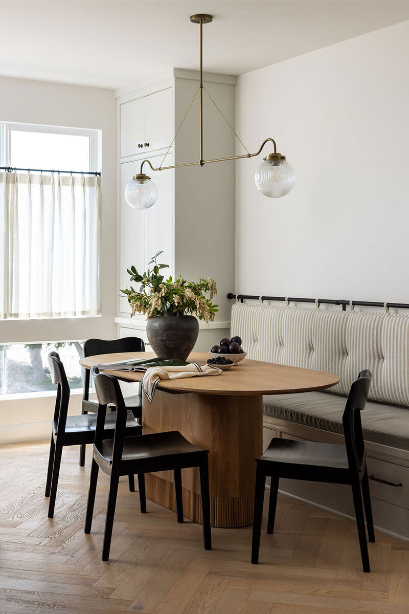 Modern dining area showcasing natural materials and timeless coastal styling
