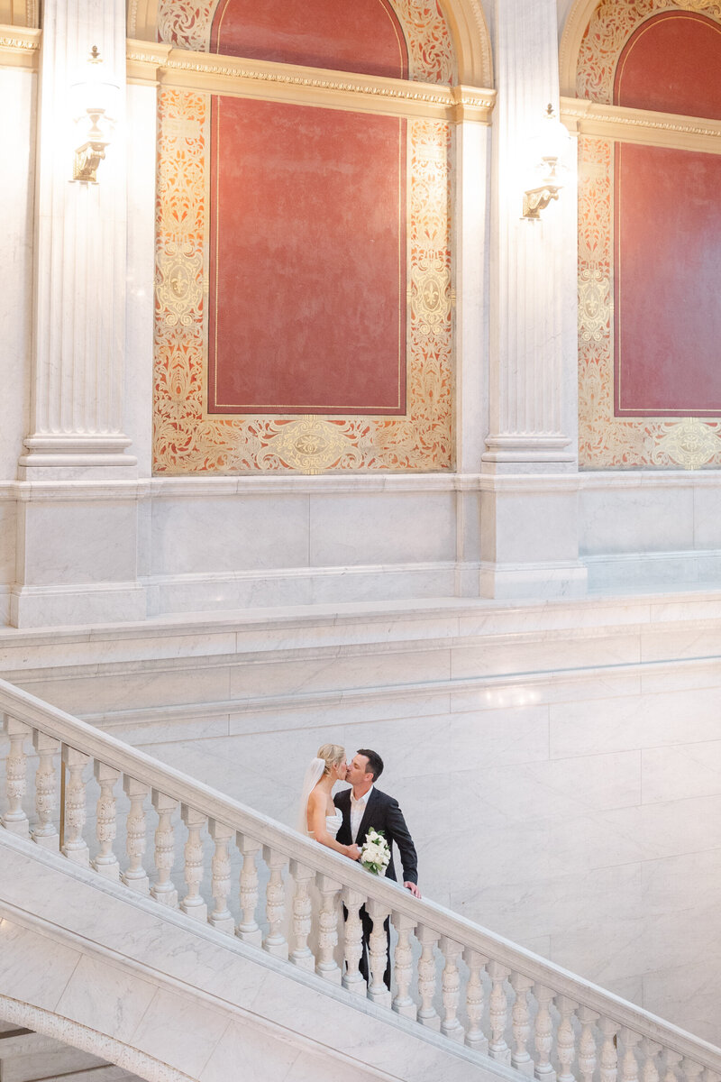bride and groom on steps at the Ohio State house