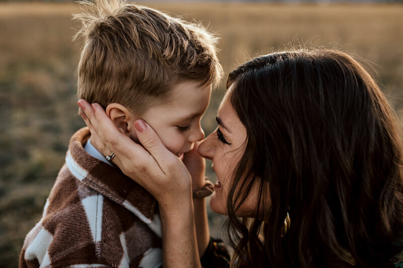 Family Photography, mother kneeling down sitting nose to nose with toddler son