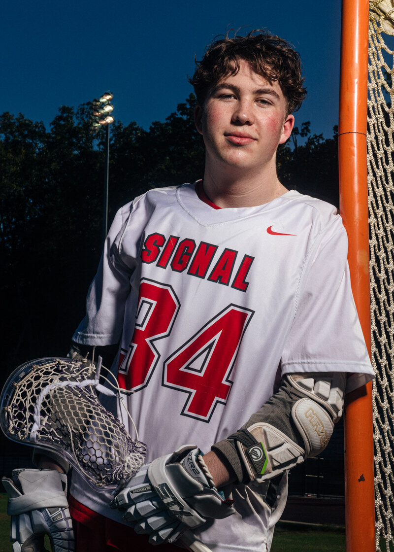 a signal mountain high school lacrosse player during a senior photoshoot