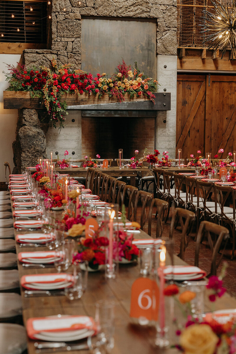 Fireplace floral installation with bold spring blooms