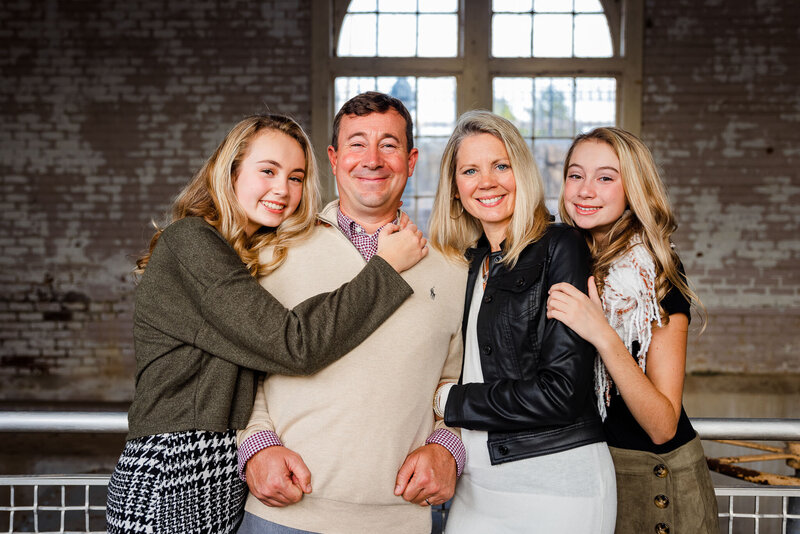 A family posing for family portraits in a park in downtown, Columbia, South Carolina