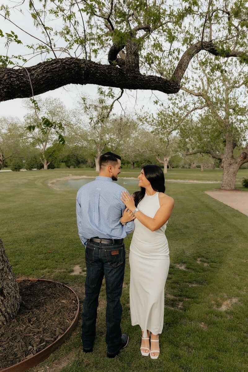 couple poses for portraits in texas