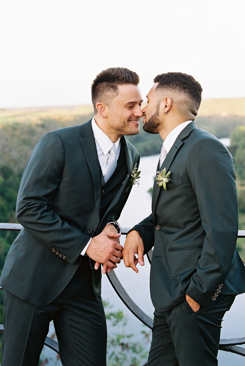 Gay couple posing at their destination wedding