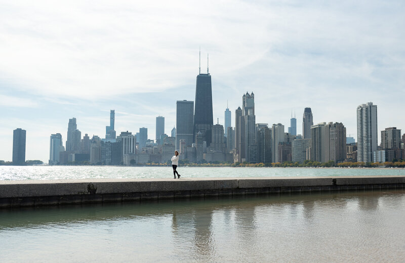 High School Senior girl standing in front of Chicago's lakefront skyline