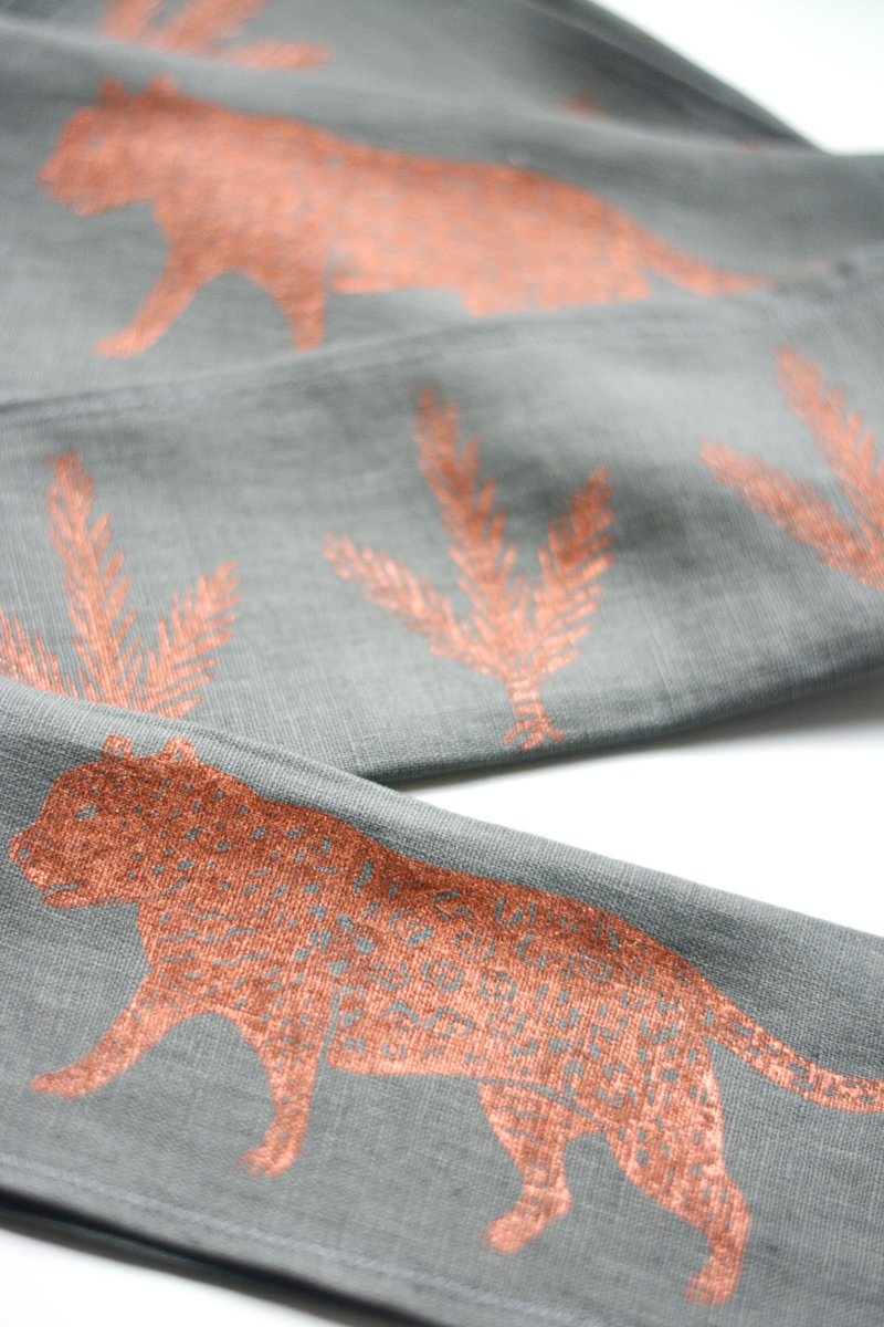 Leopard block printed linen napkin set in copper on gray by Skye McNeill