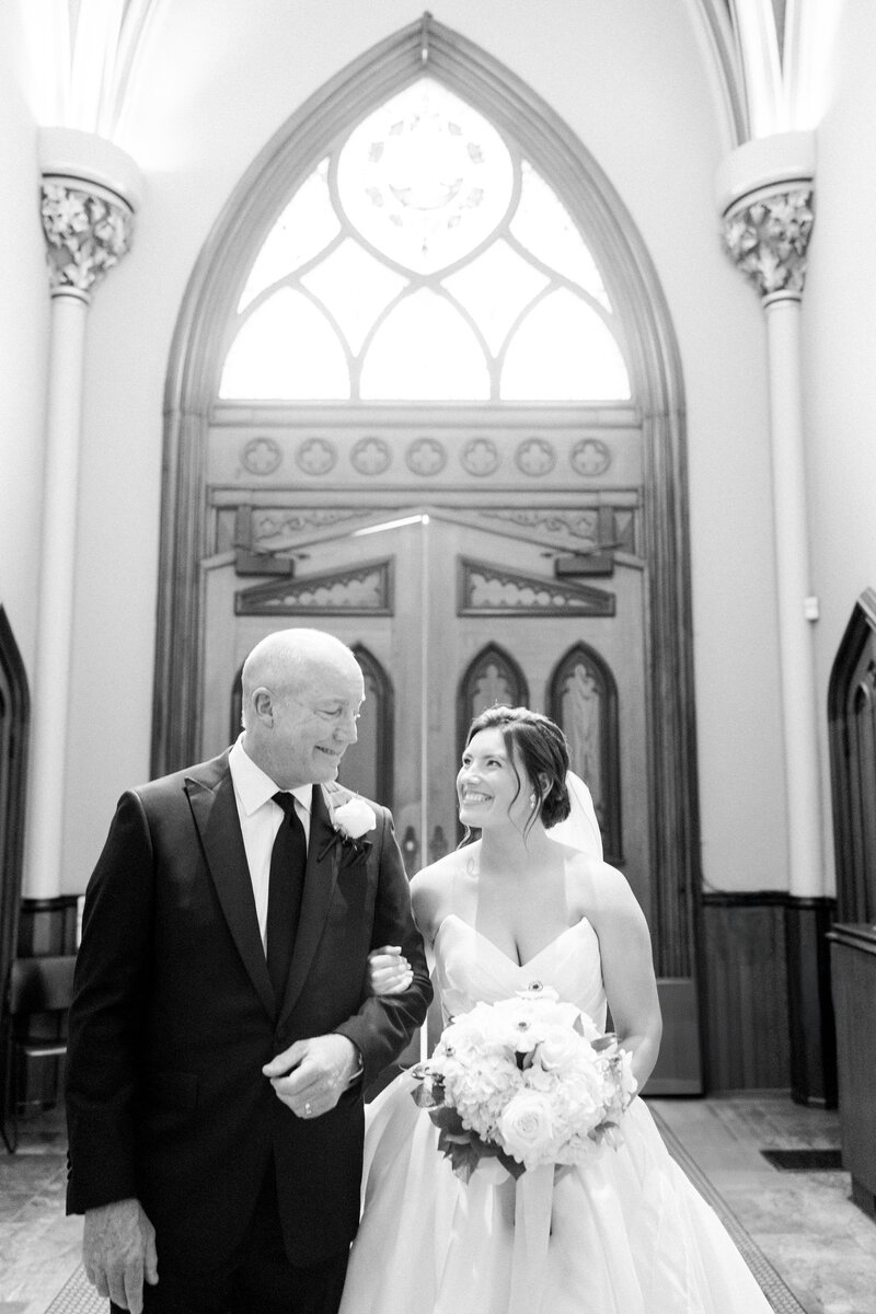 a man walking his daughter down the aisle