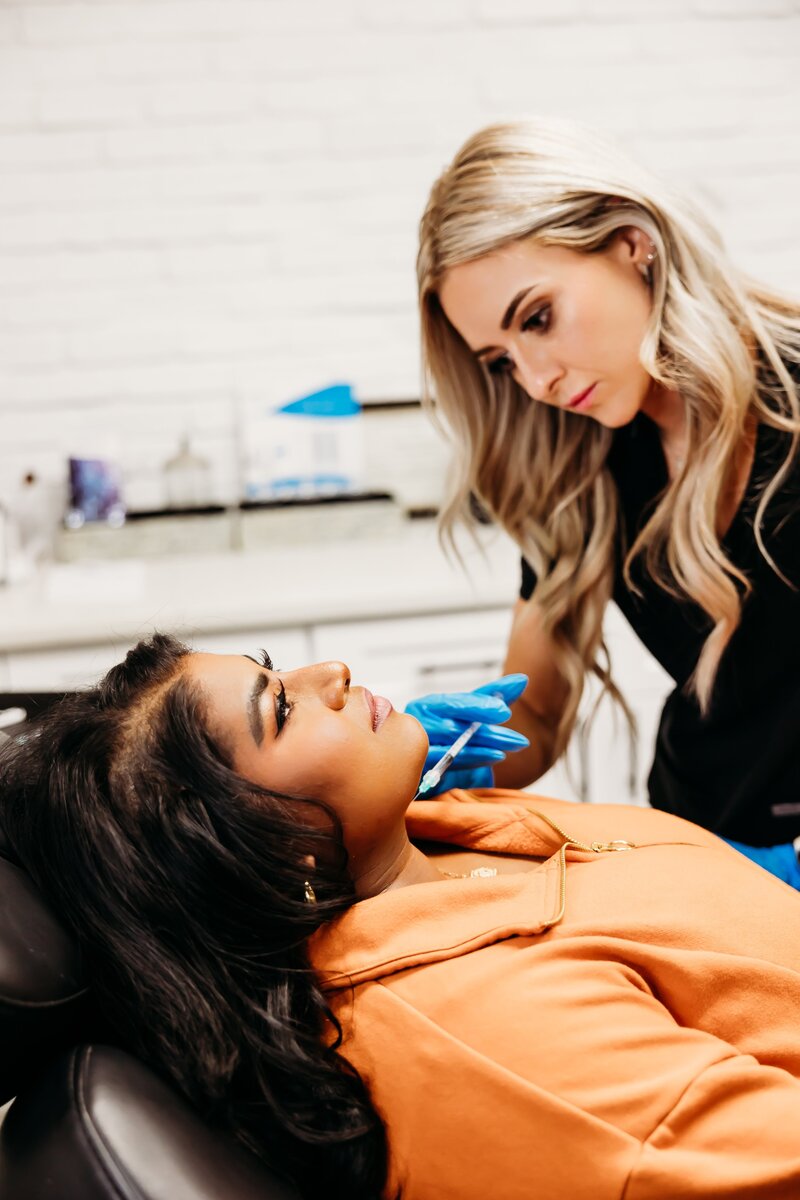 Woman receiving a lipodissolve injection