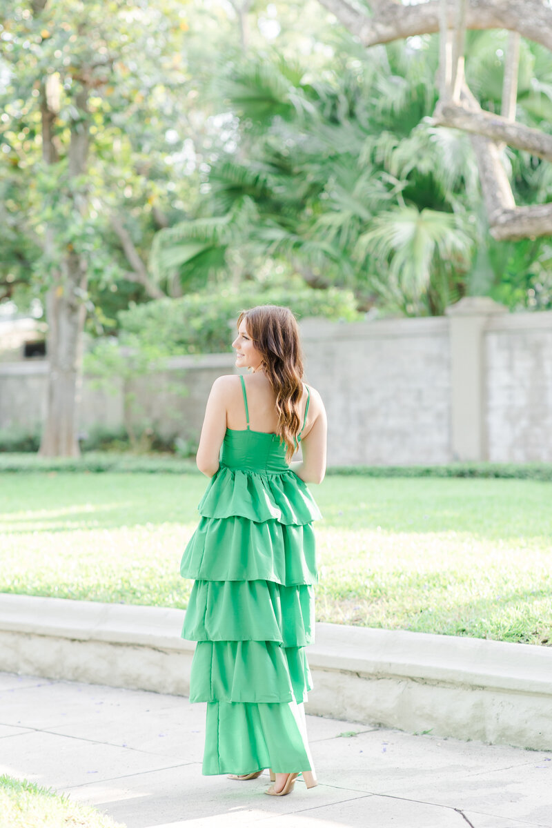 girl walking in a green dress