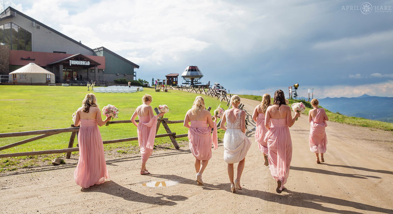 Bridesmaids make their way back to Thunderhead Lawn with the Bride at a Steamboat Ski Resort Wedding in Colorado