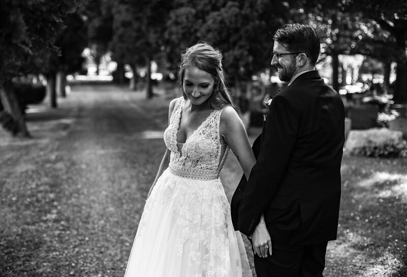 Bride and groom hanging out in cemetery in Girard PA