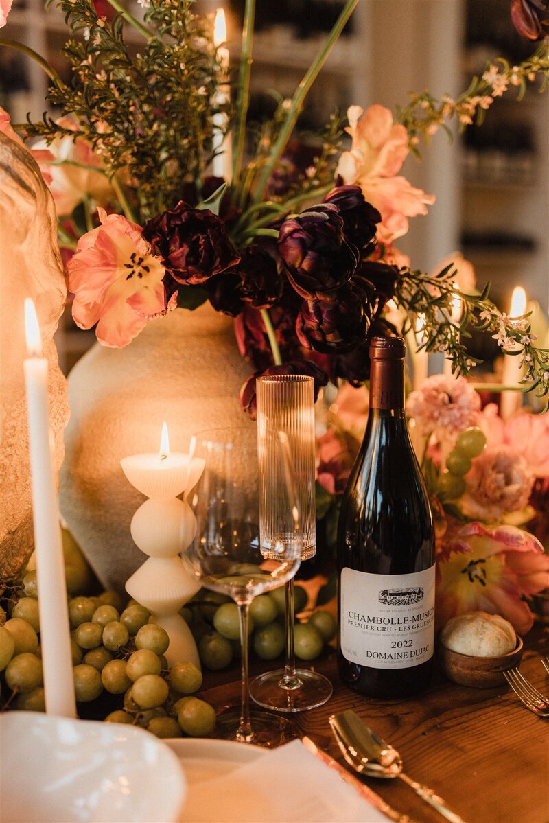 Intimate spring wedding ceremony with floral installation and candleligh