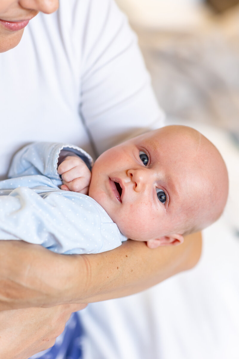 parents look down at baby boy