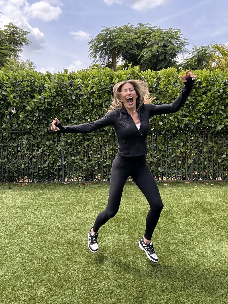 Jill dancing in an exercise outfit