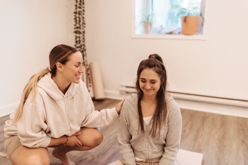Amanda and a breathwork student during a session