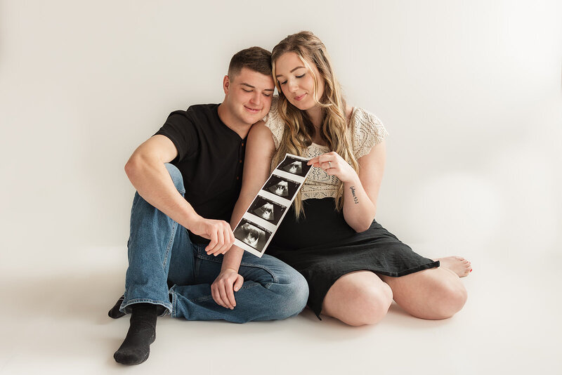 Studio pregnancy announcement with sonogram images
