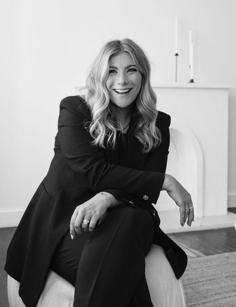 Calgary Realtor Leigh Kormos in a black and white candid photo