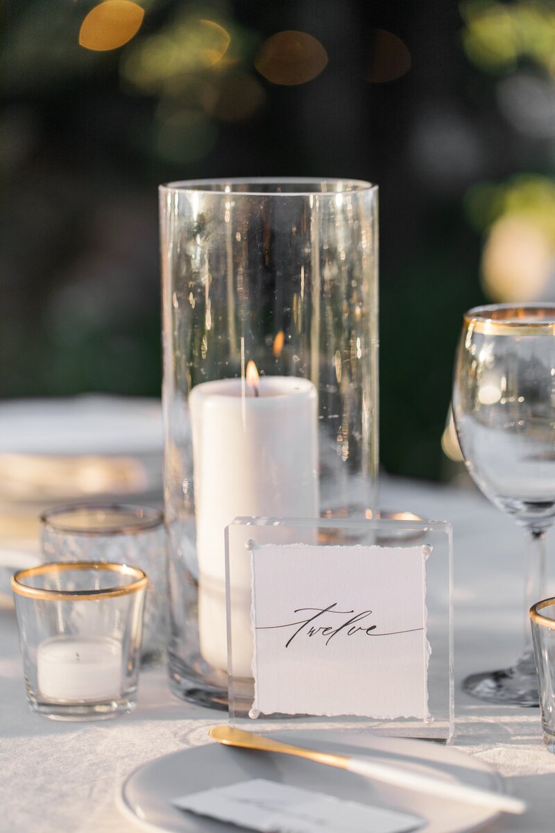 Luxury wedding table design showing the acrylic table numbers