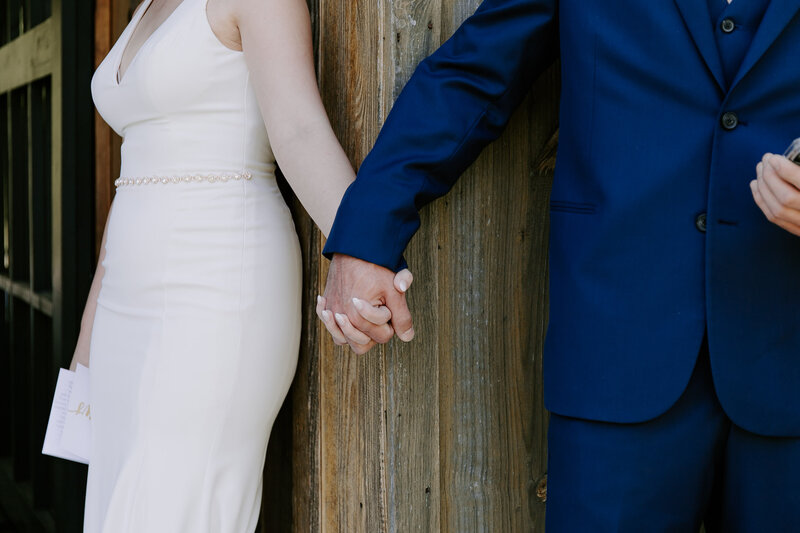 Couple holding hands at North Georgia barn wedding venue
