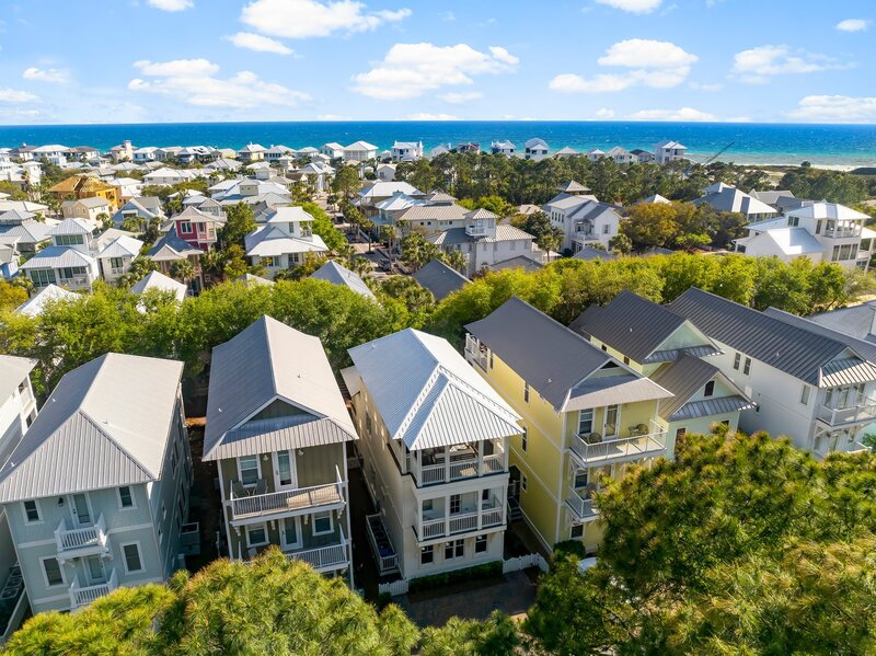 Overhead view of Tangerine Dream beach house nestled among colorful homes near the Gulf of America
