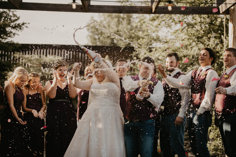 bride and groom celebrating at resplendent garden on their amarillo wedding day