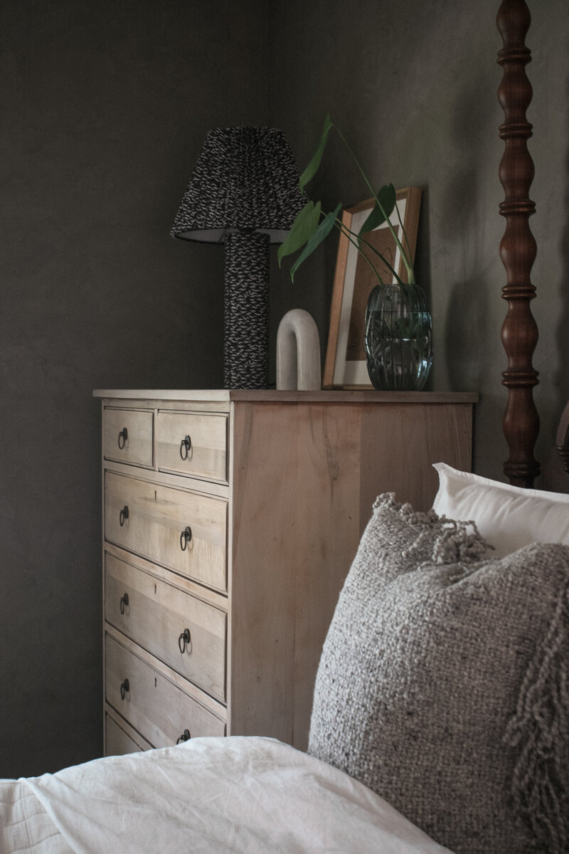 Moody, dark-toned bedroom interior designed by Hope Miriam Designs in DFW