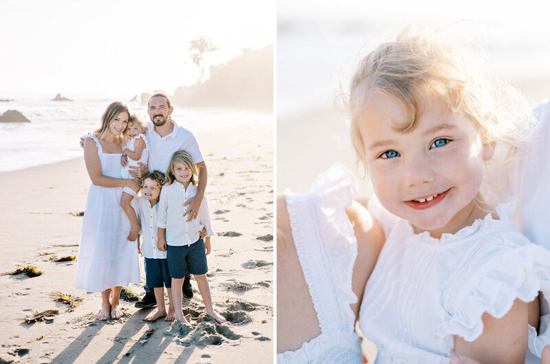 A family of five smiles at the camera on the beach during their family session with Daniele Rose Photography