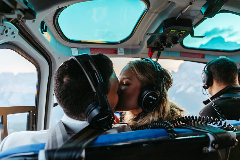 Heli kiss kissing couple elopement dolomites