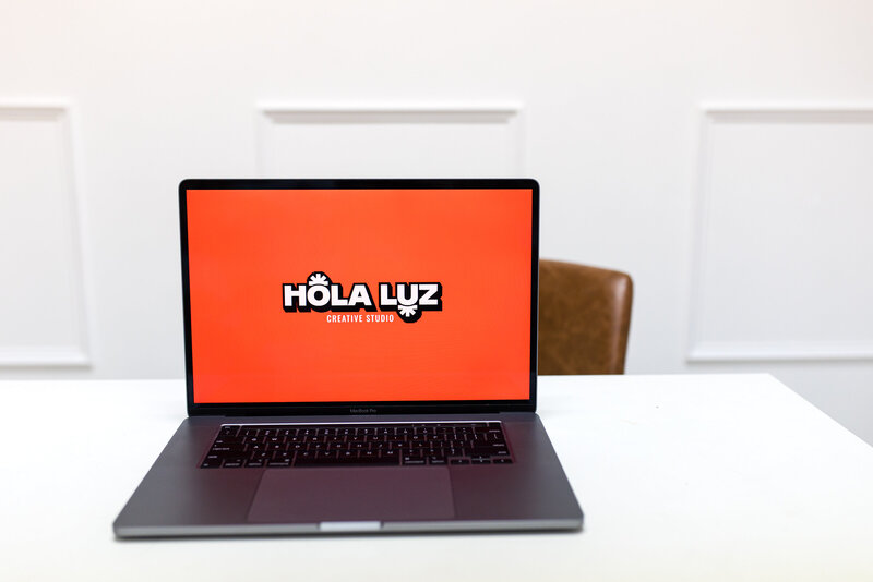 Laptop mockup featuring the main logo of a Latina-owned business, representing professional branding and entrepreneurship by women-owned businesses.