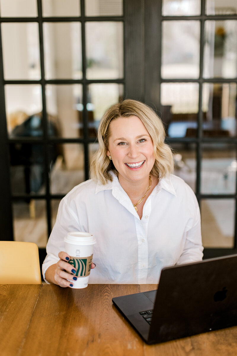 Sarah Kaetterhenry sitting in home drinking coffee
