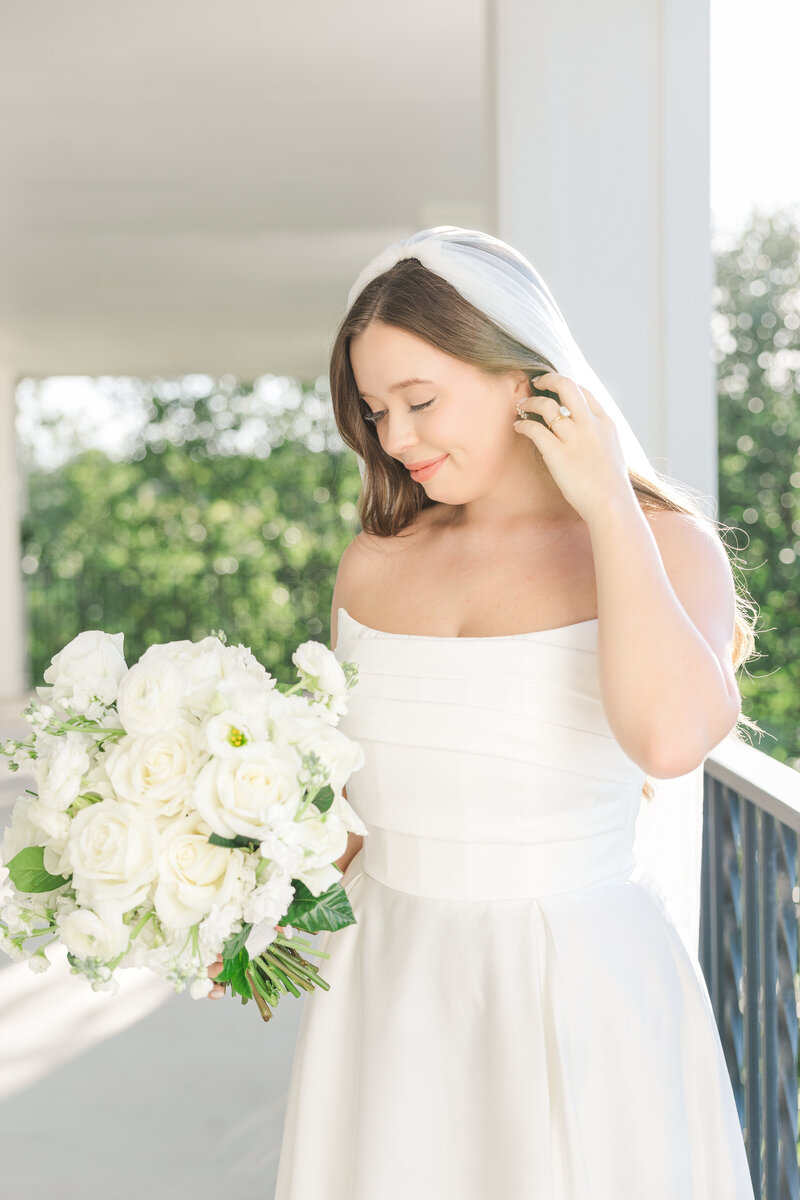 San Antonio wedding photographer captures bride and groom outside a San Antonio wedding venue kissing.