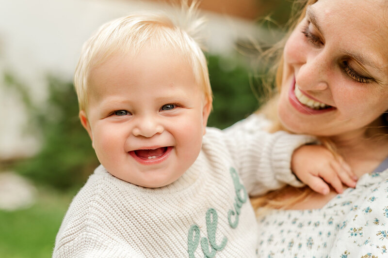 Smiling toddler photographed outdoors during a milestone photo session in York, Pennsylvania.