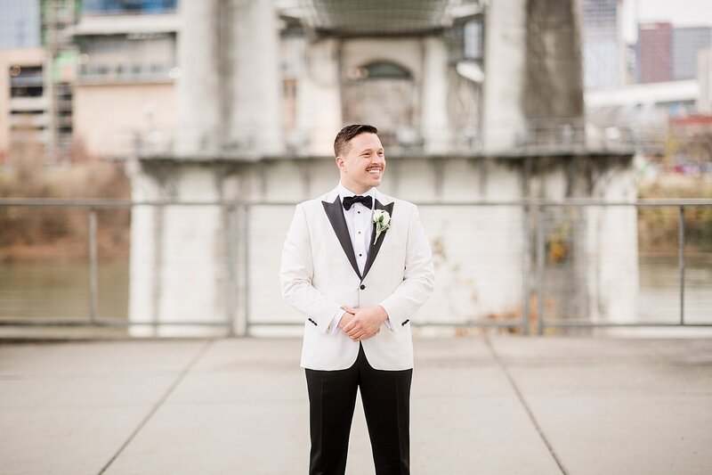 groom in white tuxedo jacket by Knoxville Wedding Photographer, Amanda May Photos