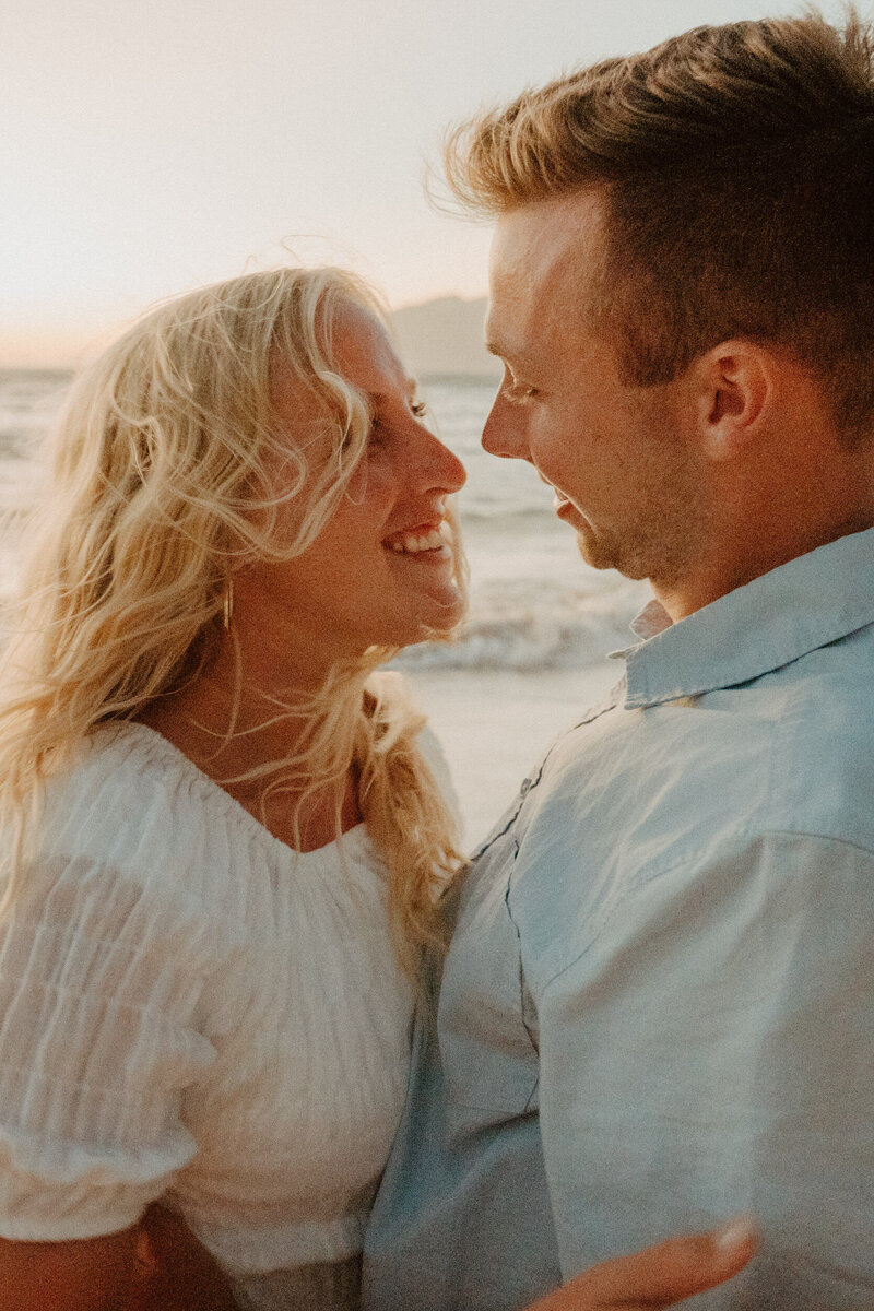 couples at golden hour kissing forehead