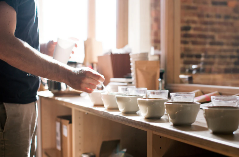 coffee cups placed in row on coffee table