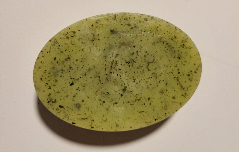 Up close photo of lavender honey oatmeal soap to show the dried lavender in the berry and balm soap