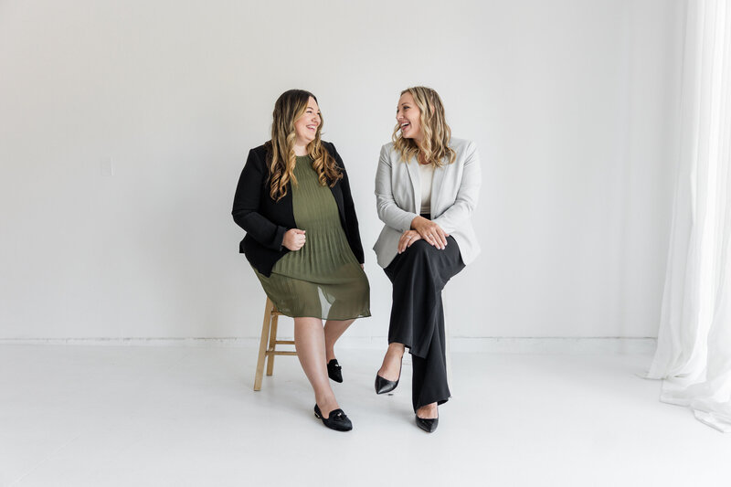 Lawyers, Paige Griffith & Alisha Suazo, smile