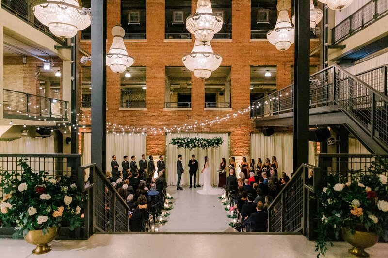 A black and white photo of a wedding ceremony at Cafe Brauer in Chicago