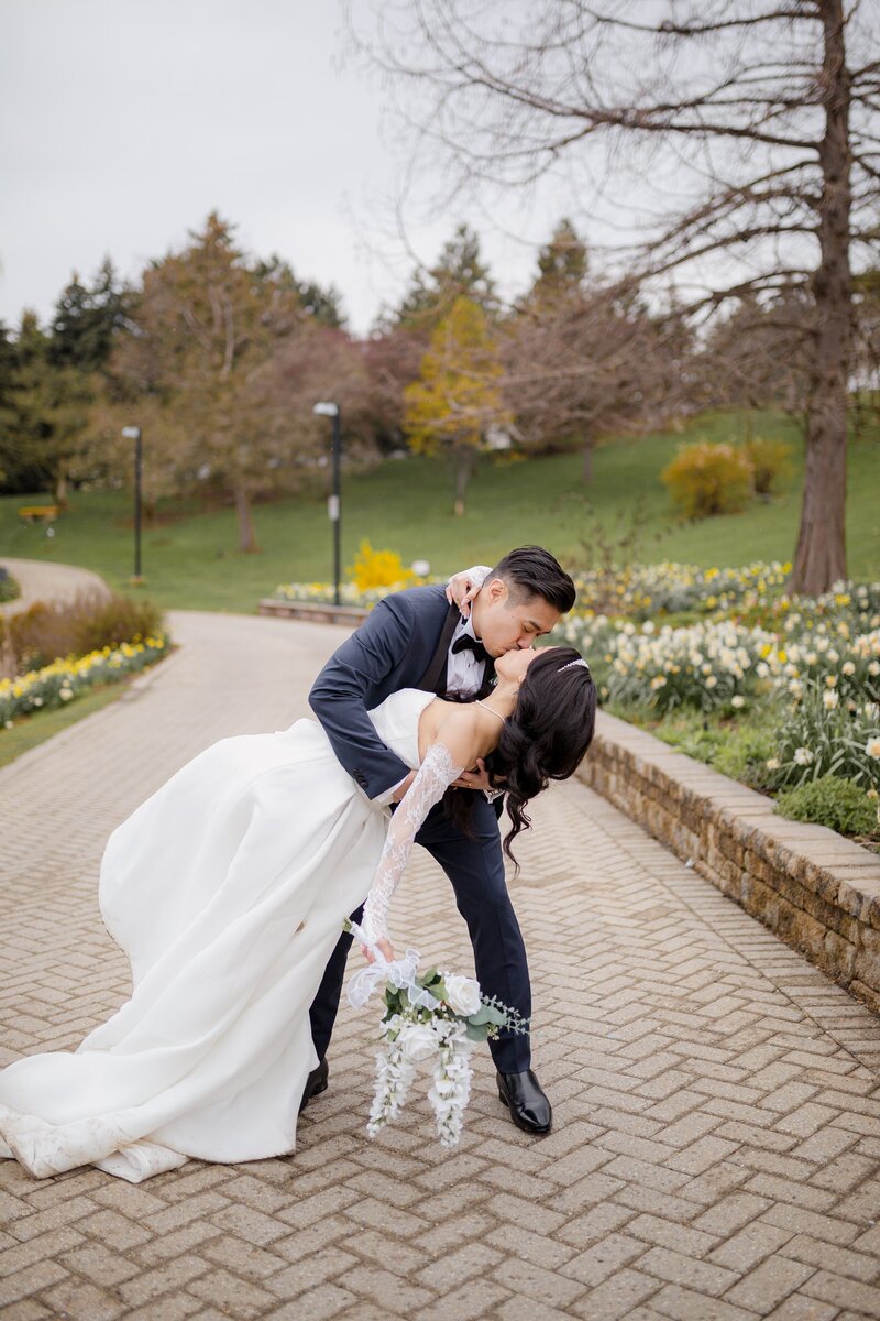 Groom dipping bride for a kiss