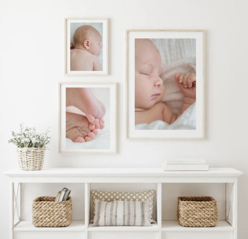 printed artwork of newborn baby hanging above a shelf by york pa photographer