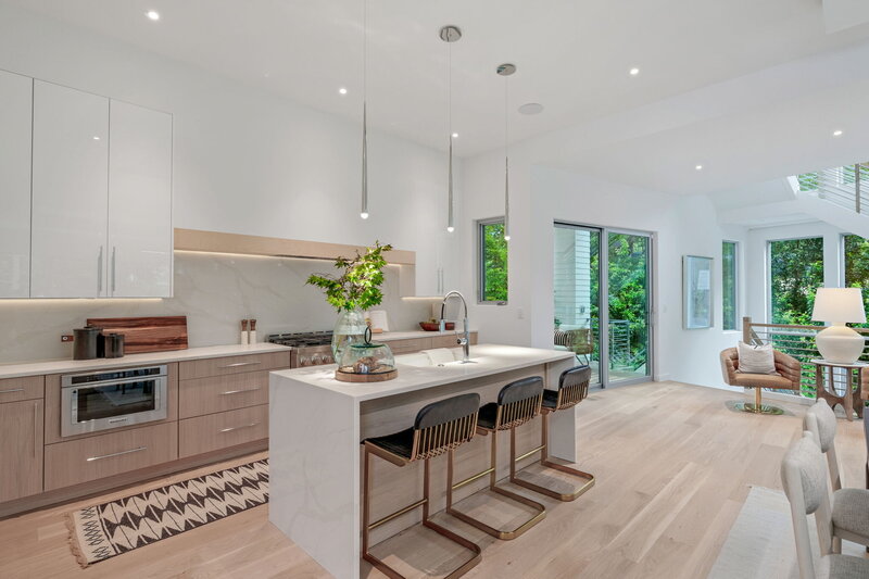 White and wood flat panel kitchen design