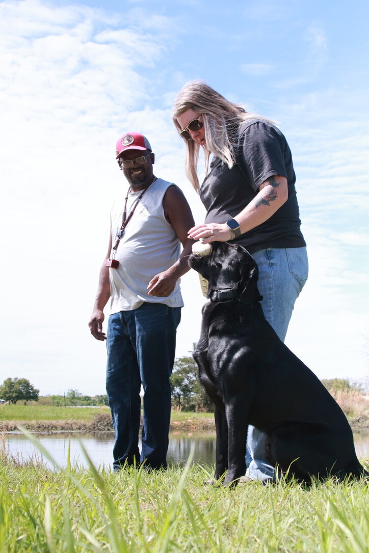 pro trainer helping client train obedient gundog